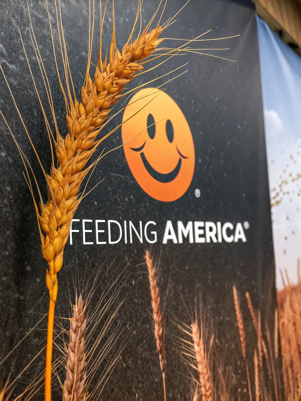 A photograph of the Feeding America logo, a nationwide network of food banks providing meals to those in need.